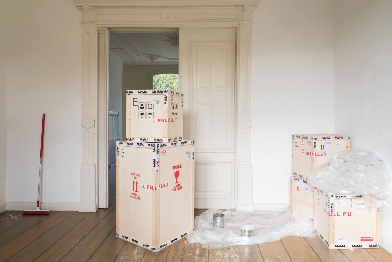 View of the second room of MoMA at the Bank Presents (2018), showing some crates